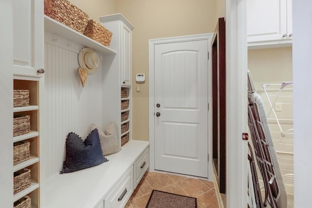 mudroom with light tile patterned floors