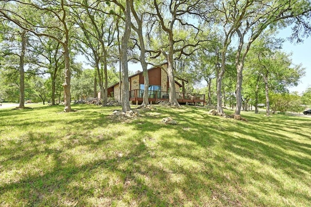 107 Phalarope Dr, Buda, TX 78610 - view of grassy yard with a deck