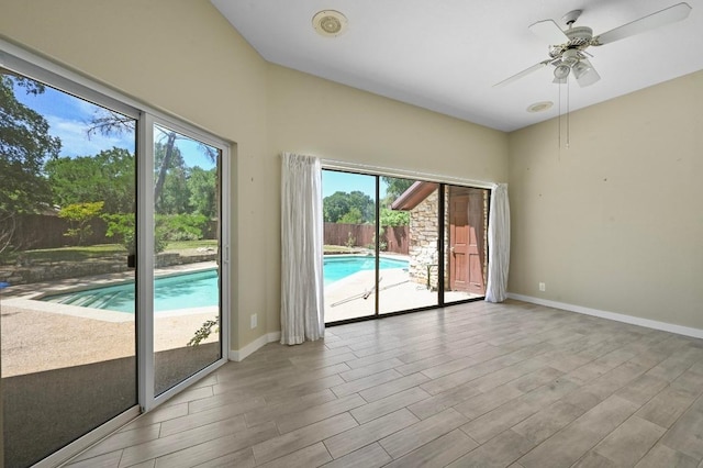 107 Phalarope Dr, Buda, TX 78610 - unfurnished room with wood finished floors, a ceiling fan, and baseboards