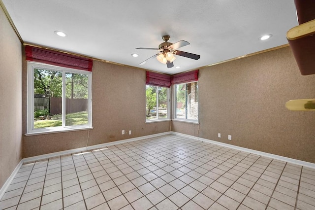 107 Phalarope Dr, Buda, TX 78610 - spare room with healthy amount of natural light, ceiling fan, recessed lighting, baseboards, and light tile patterned flooring
