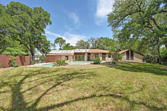 107 Phalarope Dr, Buda, TX 78610 - back of property with stone siding