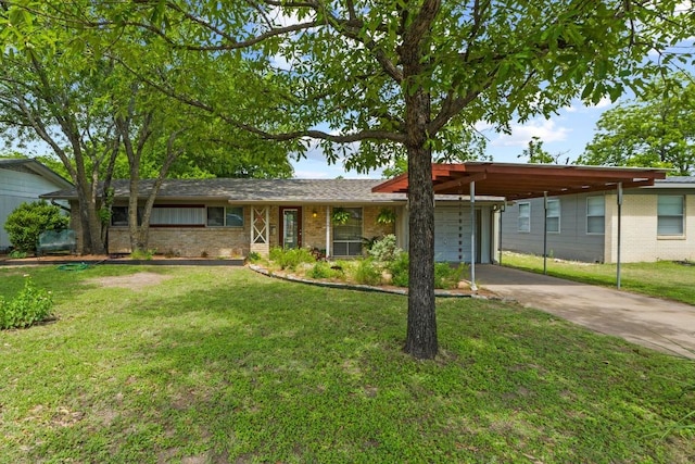 7912 Burrell Dr, Austin, TX 78757 - single story home with a front yard, concrete driveway, a garage, and brick siding