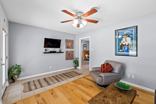 7912 Burrell Dr, Austin, TX 78757 - sitting room with ceiling fan, wood finished floors, and baseboards