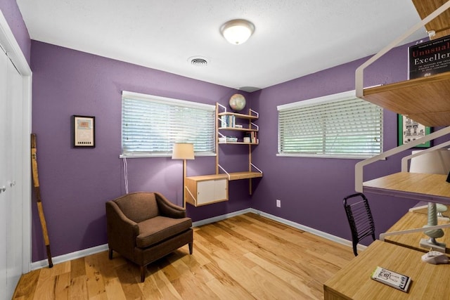 7912 Burrell Dr, Austin, TX 78757 - office with healthy amount of natural light, wood finished floors, and baseboards
