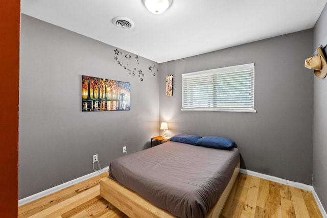 7912 Burrell Dr, Austin, TX 78757 - bedroom with wood finished floors and baseboards