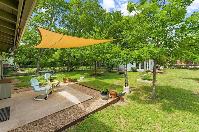 7912 Burrell Dr, Austin, TX 78757 - view of grassy yard with a patio area