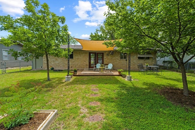 7912 Burrell Dr, Austin, TX 78757 - rear view of property featuring french doors and brick siding