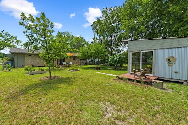 7912 Burrell Dr, Austin, TX 78757 - view of grassy yard featuring a wooden deck