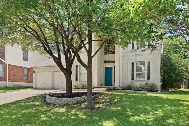 7016 Bending Oak Rd, Austin, TX 78749 - view of front of house featuring an attached garage, driveway, a front yard, and brick siding