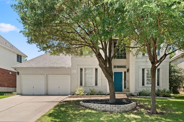 7016 Bending Oak Rd, Austin, TX 78749 - view of front facade featuring an attached garage, driveway, brick siding, a shingled roof, and a front lawn