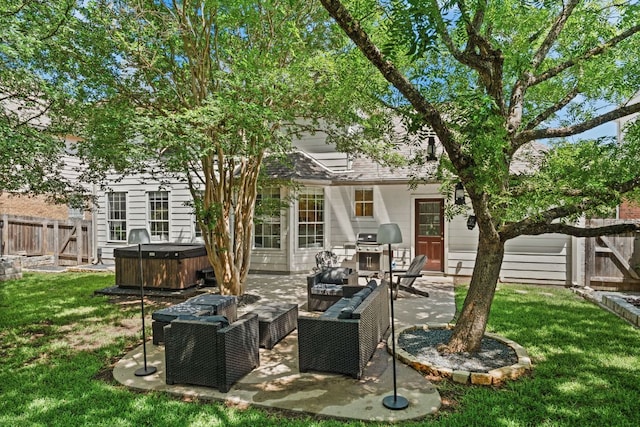 7016 Bending Oak Rd, Austin, TX 78749 - rear view of property featuring a hot tub, a patio, and an outdoor hangout area