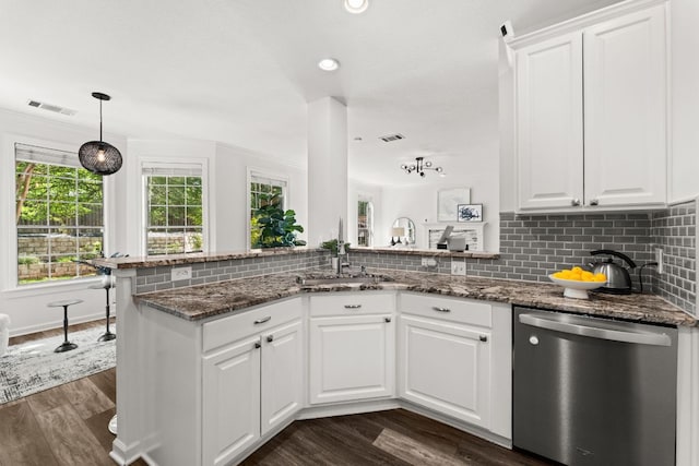 7016 Bending Oak Rd, Austin, TX 78749 - kitchen with stainless steel dishwasher, a sink, dark wood-style flooring, white cabinetry, and recessed lighting