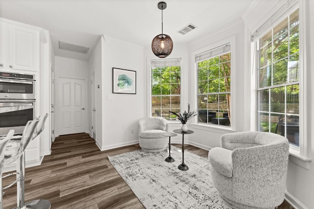 7016 Bending Oak Rd, Austin, TX 78749 - sitting room featuring dark wood finished floors, baseboards, and ornamental molding