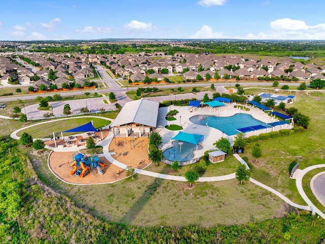 143 Dogvane Cir, Kyle, TX 78640 - aerial perspective of suburban area featuring a pool area