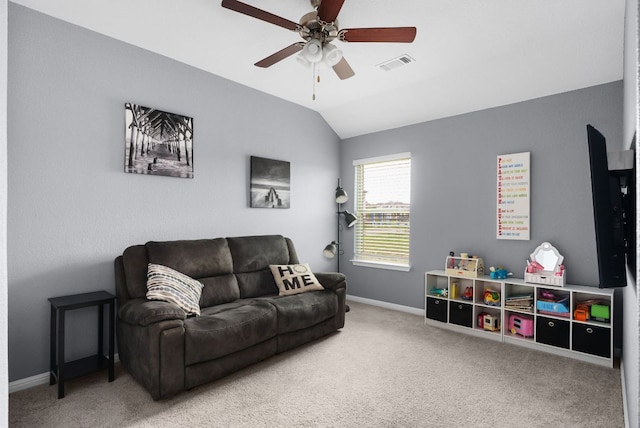 143 Dogvane Cir, Kyle, TX 78640 - living room with carpet, a ceiling fan, vaulted ceiling, and baseboards