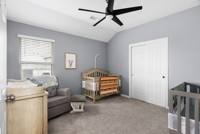 143 Dogvane Cir, Kyle, TX 78640 - carpeted bedroom featuring lofted ceiling, a crib, a closet, and ceiling fan