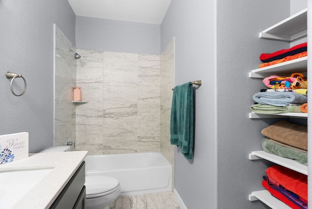 143 Dogvane Cir, Kyle, TX 78640 - bathroom featuring marble look tile flooring, toilet, baseboards, vanity, and bathing tub / shower combination