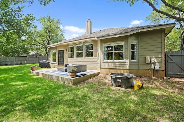 3701 Clendenin Ct, Austin, TX 78732 - rear view of house with a chimney and a patio