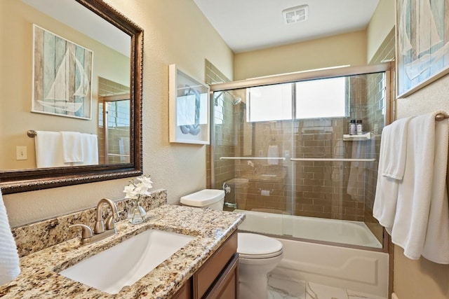 3701 Clendenin Ct, Austin, TX 78732 - bathroom featuring toilet, shower / bath combination with glass door, vanity, a textured wall, and marble finish flooring