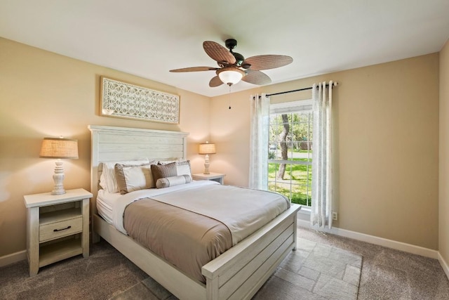 3701 Clendenin Ct, Austin, TX 78732 - bedroom featuring dark carpet, baseboards, and a ceiling fan