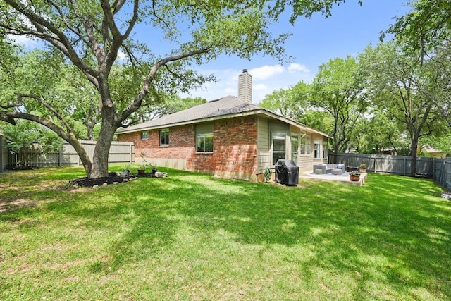 3701 Clendenin Ct, Austin, TX 78732 - rear view of property with a chimney, brick siding, and a patio area