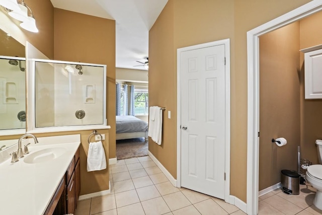 3701 Clendenin Ct, Austin, TX 78732 - bathroom featuring toilet, tile patterned floors, baseboards, a shower stall, and ceiling fan