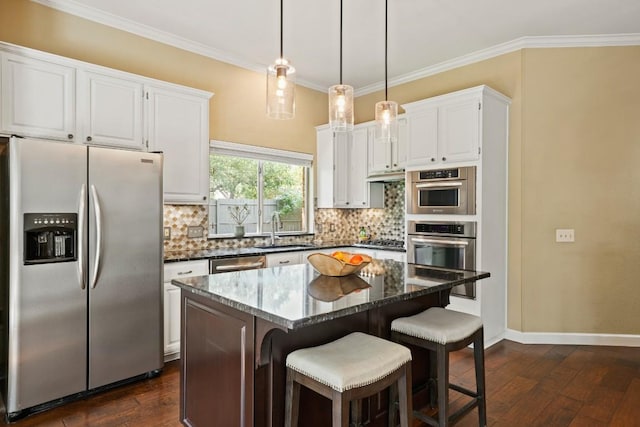 3701 Clendenin Ct, Austin, TX 78732 - kitchen featuring stainless steel appliances, a sink, tasteful backsplash, dark wood-type flooring, and ornamental molding