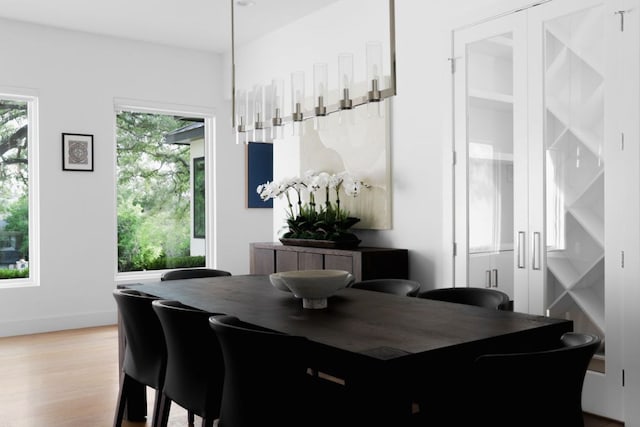 1800 Bay Hill Dr, Austin, TX 78746 - dining area with light wood-style flooring and baseboards