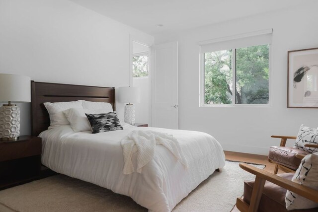 1800 Bay Hill Dr, Austin, TX 78746 - bedroom featuring baseboards and wood finished floors