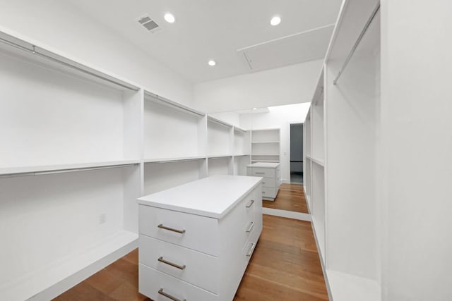 1800 Bay Hill Dr, Austin, TX 78746 - walk in closet featuring attic access and dark wood-type flooring