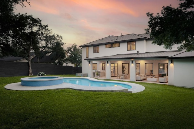 1800 Bay Hill Dr, Austin, TX 78746 - rear view of property featuring an outdoor living space, a standing seam roof, stucco siding, metal roof, and a patio