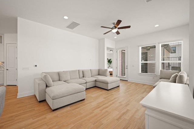 3109 Sorin St, Austin, TX 78723 - living room featuring a ceiling fan, recessed lighting, light wood-style floors, and baseboards