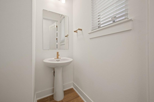 3109 Sorin St, Austin, TX 78723 - bathroom featuring baseboards and wood finished floors