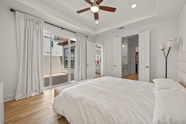 3109 Sorin St, Austin, TX 78723 - bedroom featuring access to outside, light wood finished floors, a raised ceiling, recessed lighting, and ceiling fan