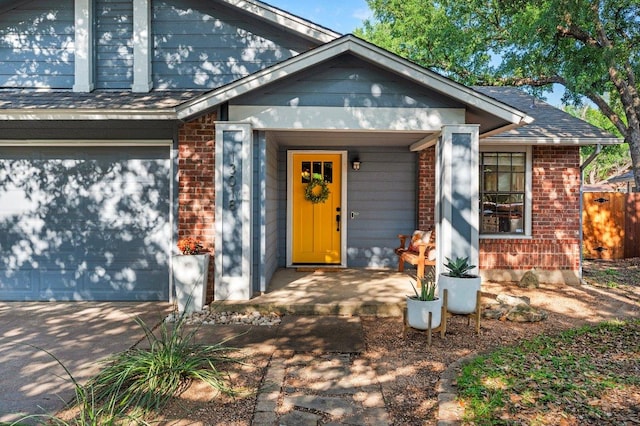 13018 Garfield Ln, Austin, TX 78727 - view of front facade featuring brick siding, a garage, and concrete driveway