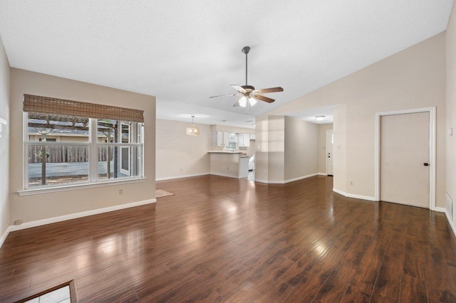 13018 Garfield Ln, Austin, TX 78727 - unfurnished living room with a ceiling fan, wood finished floors, and lofted ceiling