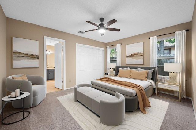 13018 Garfield Ln, Austin, TX 78727 - bedroom featuring carpet floors, multiple windows, baseboards, and a textured ceiling