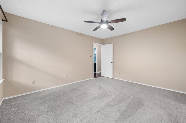 13018 Garfield Ln, Austin, TX 78727 - spare room featuring a ceiling fan, baseboards, and carpet