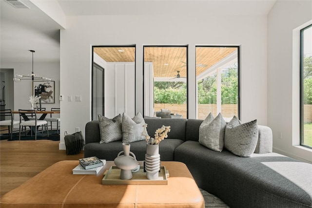 5805 Mojave Dr, Austin, TX 78745 - living area with wood finished floors and a chandelier