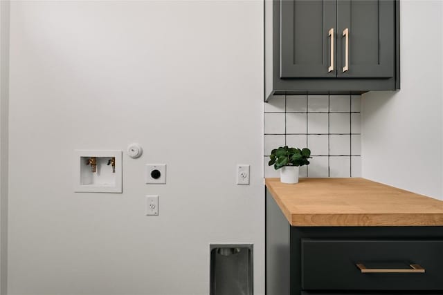 laundry room with cabinet space, hookup for an electric dryer, hookup for a gas dryer, and hookup for a washing machine
