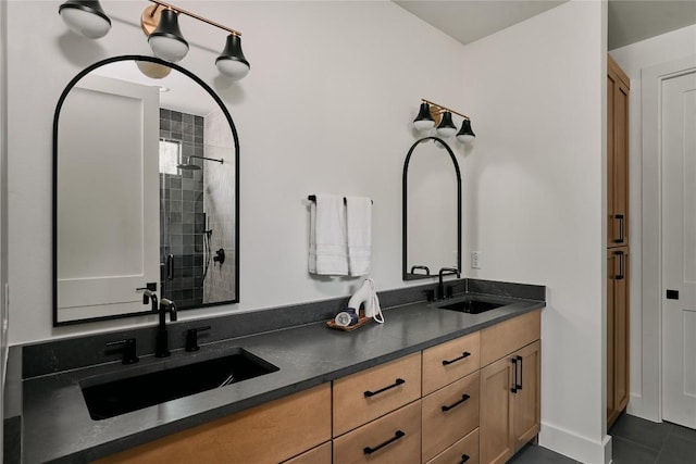 5805 Mojave Dr, Austin, TX 78745 - full bath featuring double vanity, tiled shower, and tile patterned floors