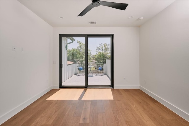 5805 Mojave Dr, Austin, TX 78745 - empty room featuring baseboards, light wood finished floors, a ceiling fan, and a smoke detector