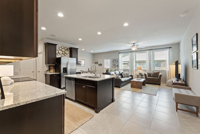537 Appalachian Trl, Leander, TX 78641 - kitchen featuring a sink, appliances with stainless steel finishes, open floor plan, ceiling fan, and dark brown cabinetry
