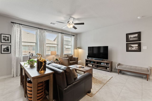 537 Appalachian Trl, Leander, TX 78641 - living area with ceiling fan, light tile patterned floors, and baseboards