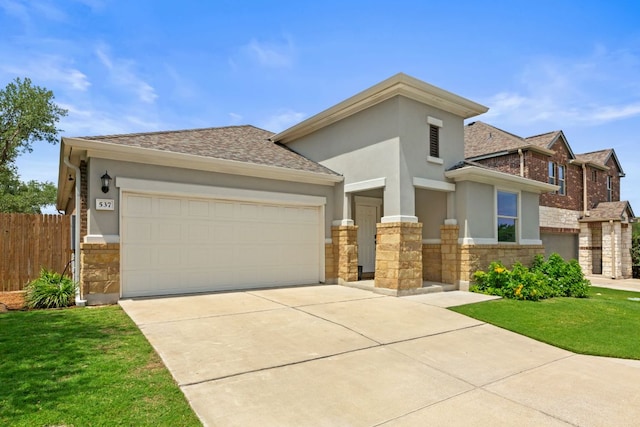 537 Appalachian Trl, Leander, TX 78641 - view of front facade featuring stone siding, stucco siding, a garage, concrete driveway, and roof with shingles