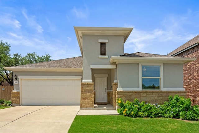537 Appalachian Trl, Leander, TX 78641 - view of front facade with concrete driveway, stone siding, a garage, and stucco siding