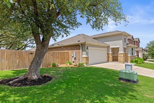 537 Appalachian Trl, Leander, TX 78641 - view of front of home featuring a garage, stucco siding, concrete driveway, stone siding, and a shingled roof