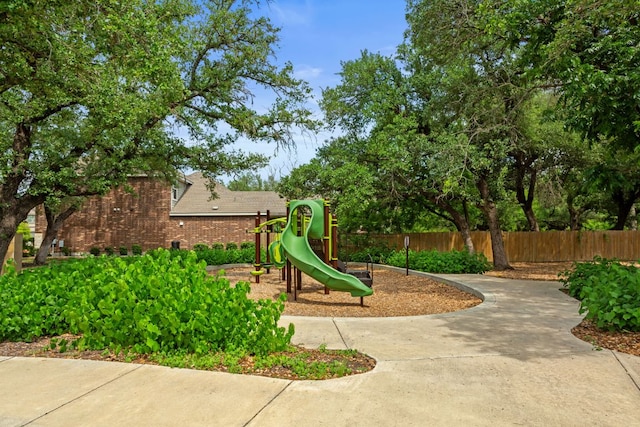 community jungle gym featuring fence