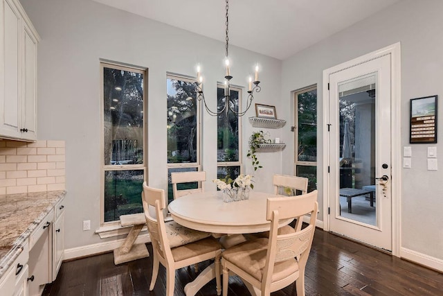 2516 Arion Cir, Austin, TX 78730 - dining area with baseboards, dark wood-style floors, and a chandelier