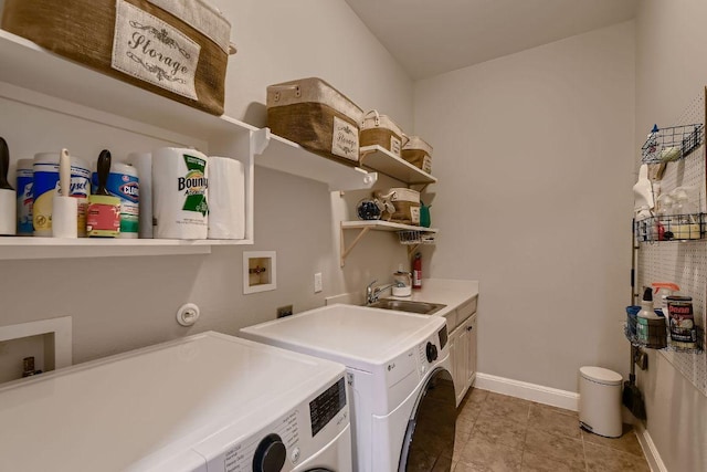 2516 Arion Cir, Austin, TX 78730 - washroom featuring cabinet space, washer and dryer, and baseboards